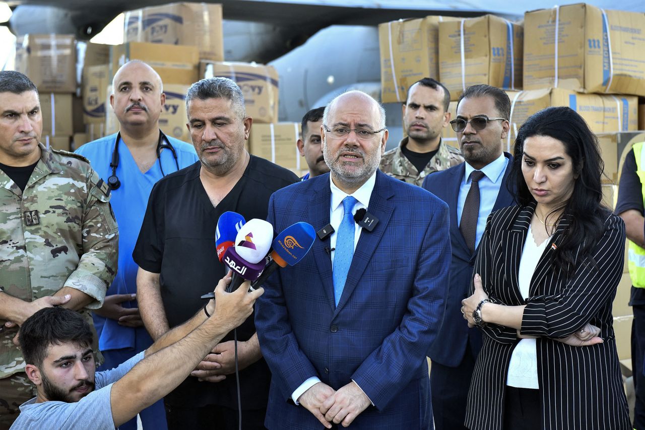 Lebanon's Health Minister Firass Abiad, center, speaks to reporters from Beirut International Airport, Lebanon, on September 18.