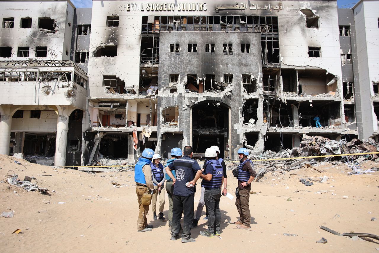 A United Nations team inspects the grounds of Al-Shifa hospital after an Israeli raid on April 8.