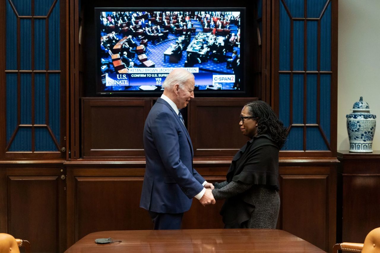 Biden holds hands with?Ketanji Brown Jackson?as the Senate votes on her nomination to the US Supreme Court in April 2022. Jackson was confirmed and made history as?the first Black woman on the court.?