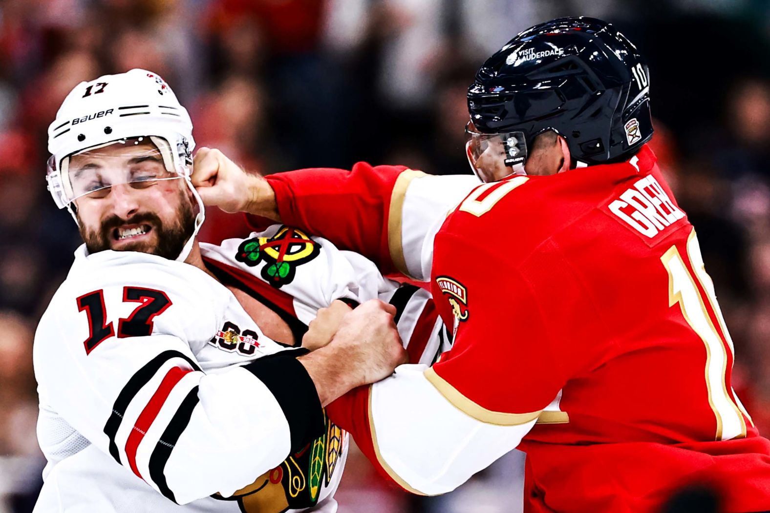 The Florida Panthers’ A.J. Greer punches the Chicago Blackhawks’ Nick Foligno during the NHL teams’ season opener in Sunrise, Florida, on Tuesday, October 7. Both players received a five-minute penalty for fighting.