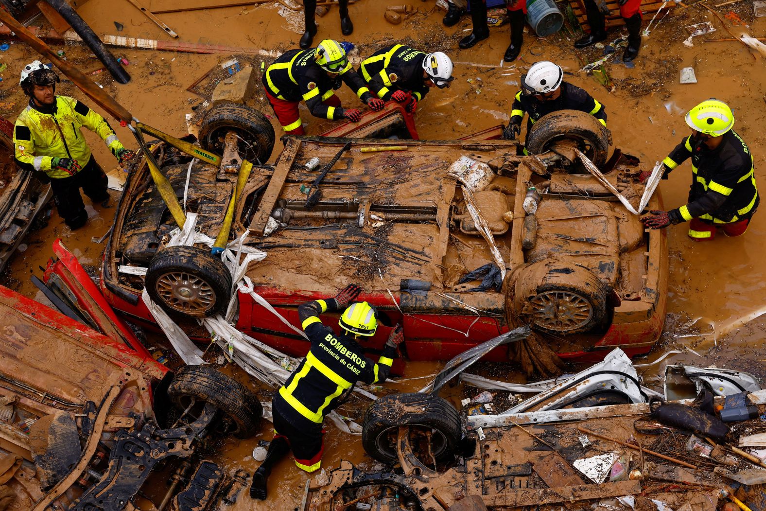 Firefighters search for possible victims inside a car that was stranded in a tunnel in Alfafar on Friday.