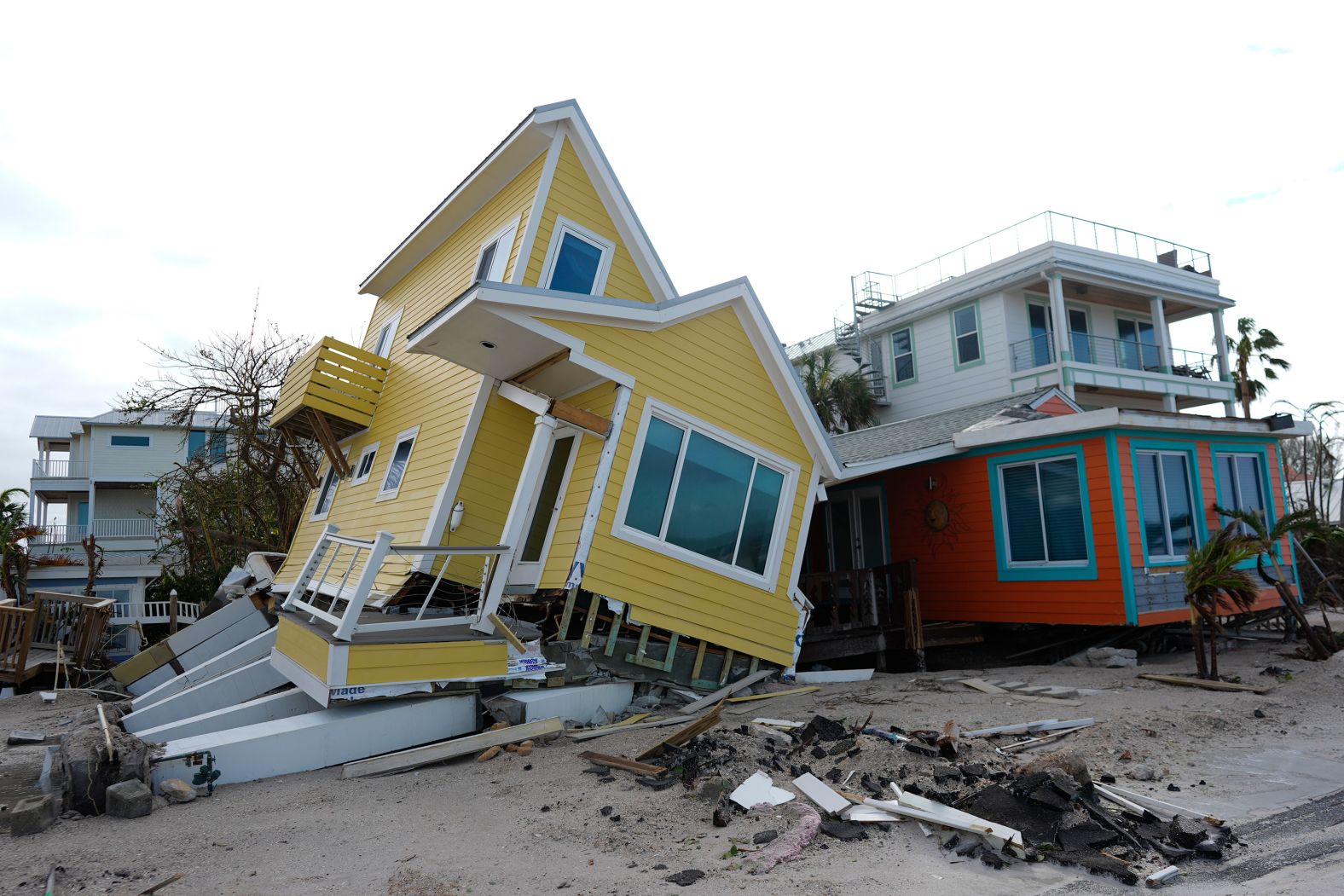 A house lies toppled off its stilts after Milton passed through Florida's Bradenton Beach.