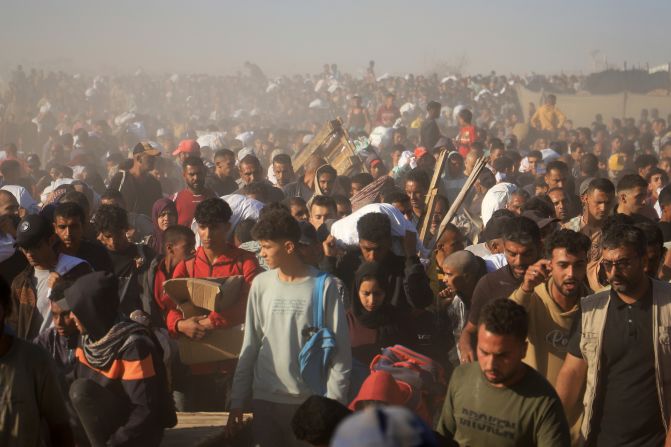 Palestinians in Rafah, Gaza, carry boxes and bags containing food and humanitarian aid packages delivered by the Gaza Humanitarian Foundation, a US-backed organization approved by Israel, on Thursday, May 29. Aid distribution efforts in Gaza <a  target="_top" href="/newspapers?url=https://www.cnn.com/2025/05/29/middleeast/israel-condemnation-gaza-aid-distribution-intl">devolved into chaos</a> during the first days of a controversial new mechanism backed by the United States and Israel. According to the Palestinian health ministry, 11 people have been killed and dozens injured as crowds of desperate people arrived at distribution sites in southern Gaza since they opened earlier this week. The Gaza Humanitarian Foundation said on Thursday that no one was killed or injured during the distribution of aid.