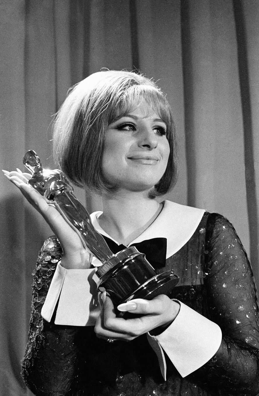 Streisand holds her Oscar for "Funny Girl" in 1969. She and Katharine Hepburn were named best actress in a rare tie.