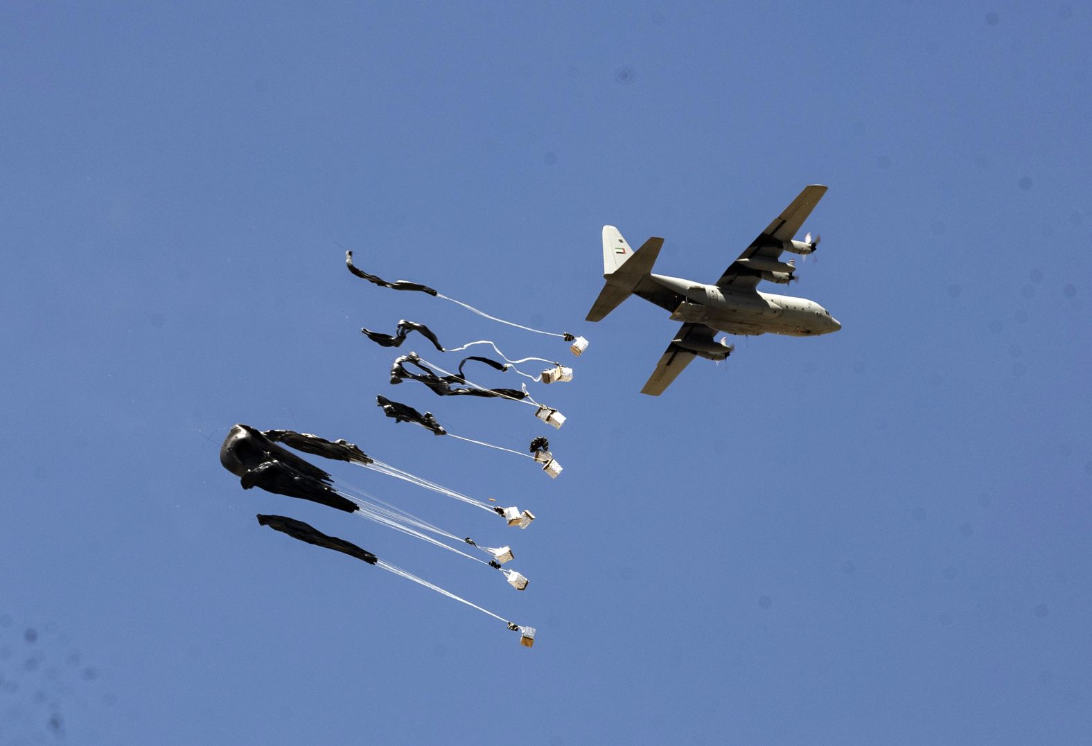 An airplane drops humanitarian aid over Gaza on Sunday, July 27. Philippe Lazzarini, the head of the United Nations agency for Palestinian refugees, called the drops a “distraction,” saying they will do little to alleviate <a href="index.php?page=&url=https%3A%2F%2Fwww.cnn.com%2Finteractive%2F2025%2F07%2Fworld%2Fphotos-starvation-in-gaza-intl-cnnphotos%2F">suffering in the enclave</a>.
