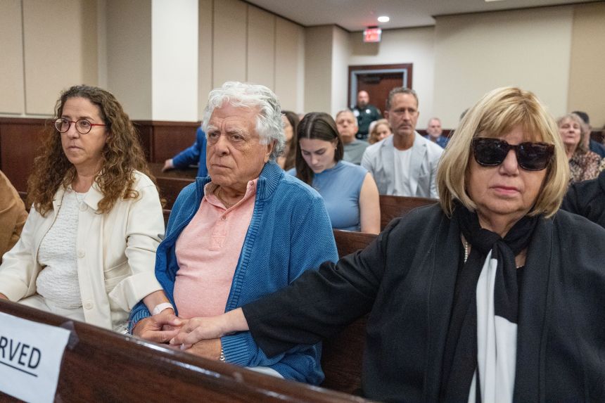 Shelly, Phil and Ruth Markel hold hands as the verdict is read for Donna Adelson on Thursday. Adelson was found guilty of the murder of Dan Markel.