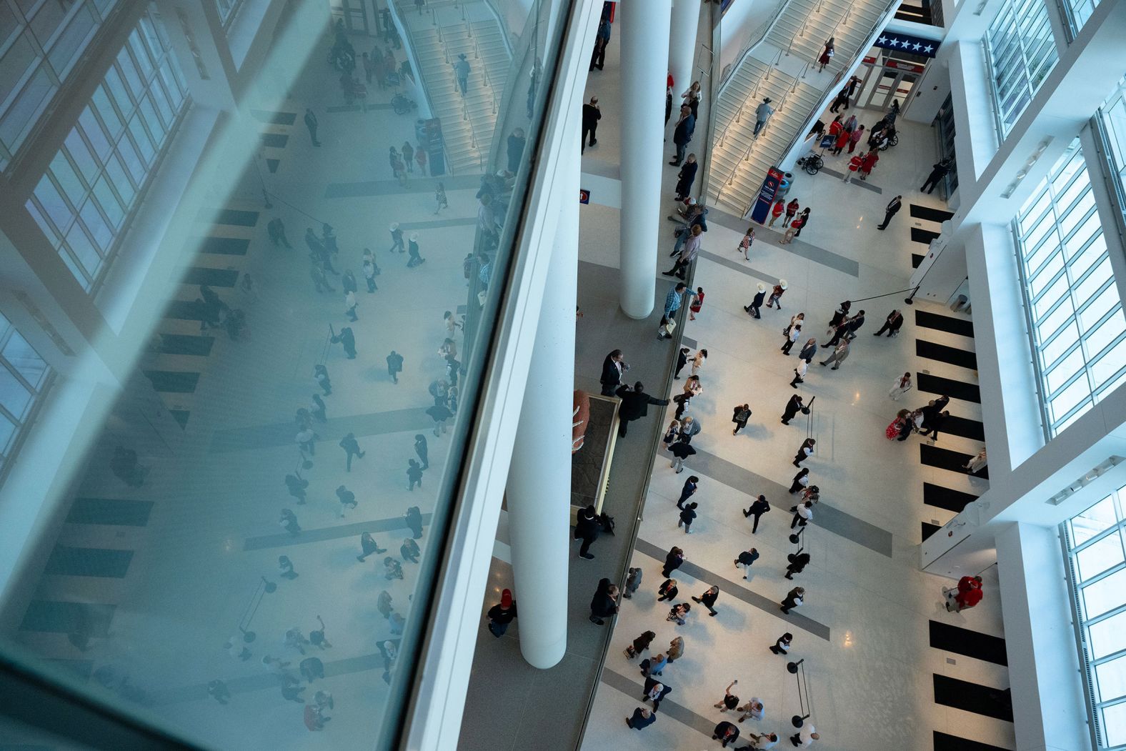 People enter the Fiserv Forum on Tuesday.