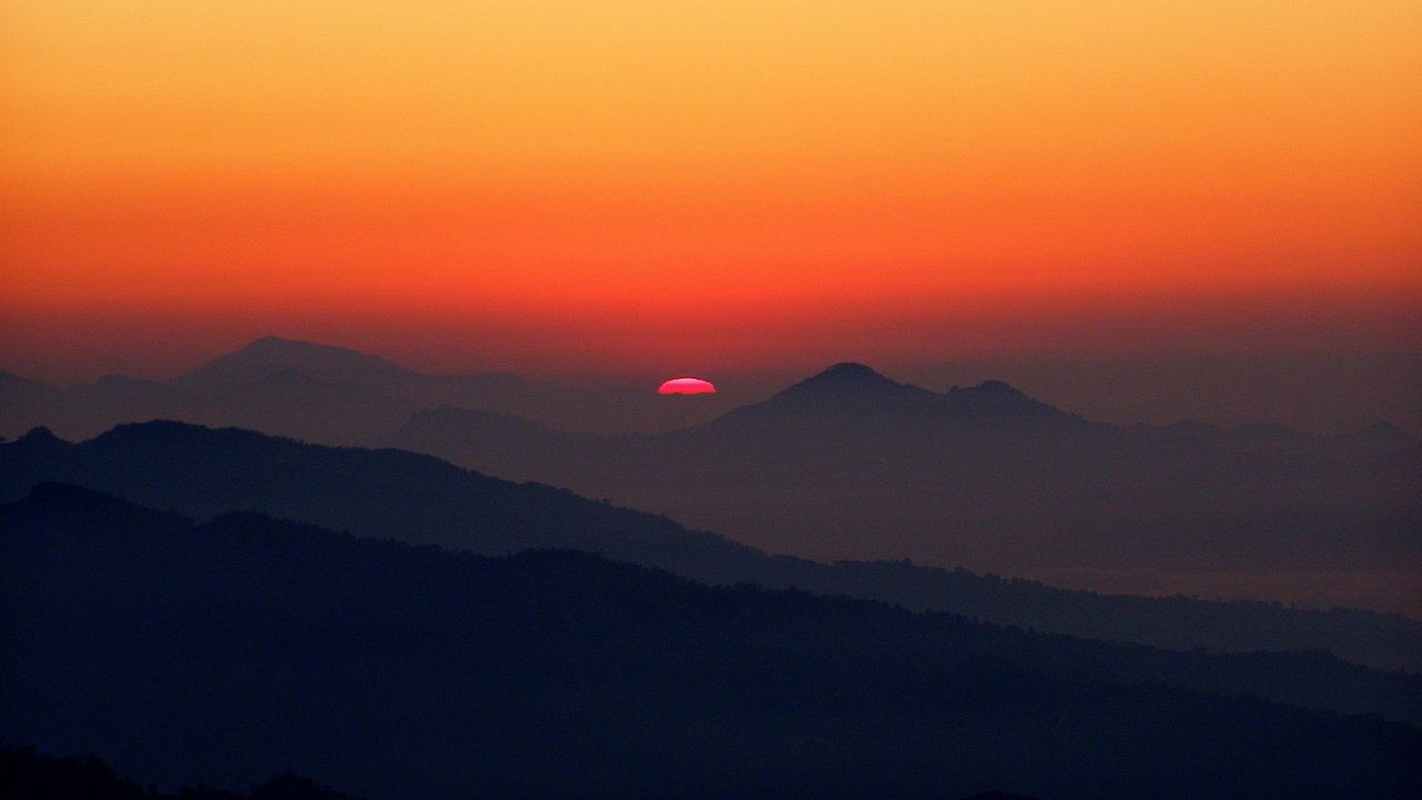 Think of a serene image, like this Nepal sunset, when boarding a plane.