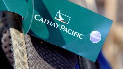 A Cathay Pacific luggage label on a suitcase