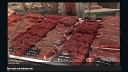 Hamburger, steaks and beef sit in the counter of a grocery store.