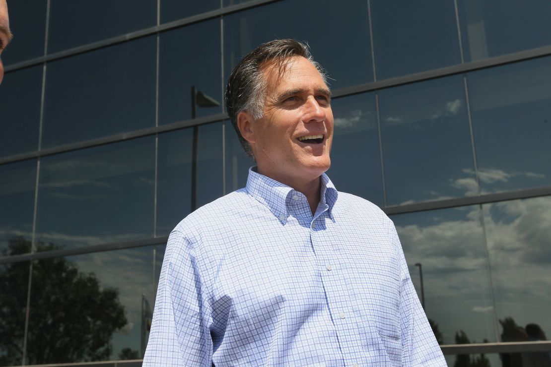 Mitt Romney arrives for a business roundtable to discuss the economy during an August 10 campaign stop in Pella, Iowa.