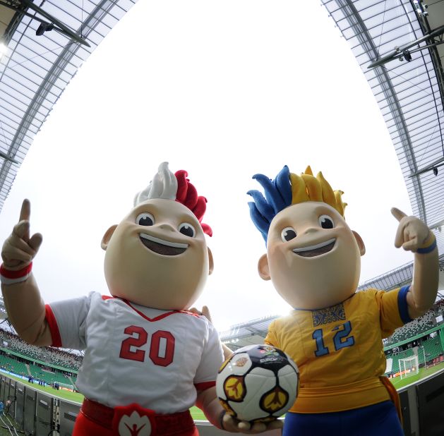 Meet Slavek and Slavko, the 2012 European Cup twin mascots.  Poland and Ukraine are co-hosting the football championships, which will kick off in Warsaw on June 8.  Wearing the red and white colors of the Polish national team uniform, Slavek represents Poland.  