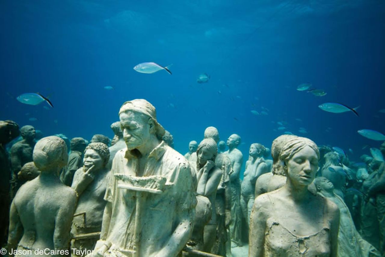 The work of British sculptor Jason deCaires Taylor, each sculpture is individually cast and made using special cement mix to encourage coral growth.