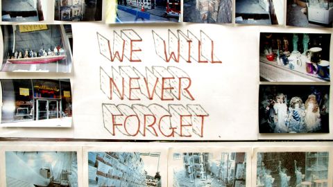 A little more than a year after 9/11, a sign in the window of a Hallmark store near ground zero had photos of the damage.