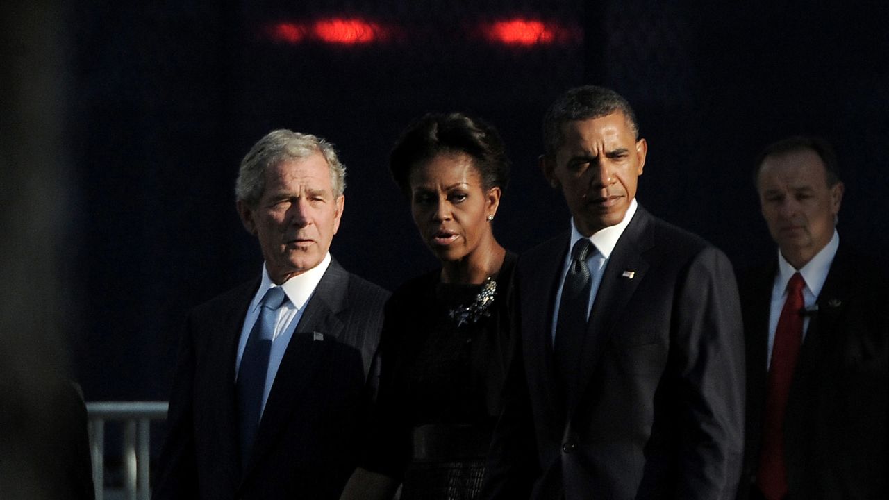 Former President George W. Bush, first lady Michelle Obama and President Barack Obama at the 9/11 Memorial in New York during the 1oth anniversary observance.