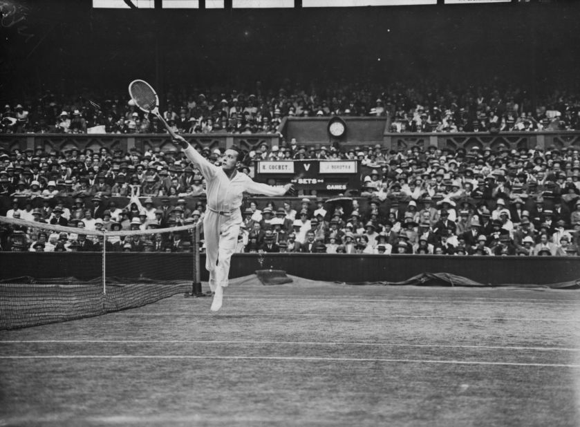 Cochet, known as "the Ball Boy of Lyon," returns a shot against Borotra in the semifinals at the 1925 Wimbledon Championships. Borotra won, but lost in the final to Lacoste. 