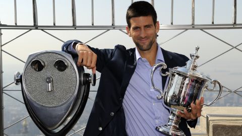 Novak Djokovic poses with his U.S. Open trophy atop the Empire State Building in New York  on Tuesday.