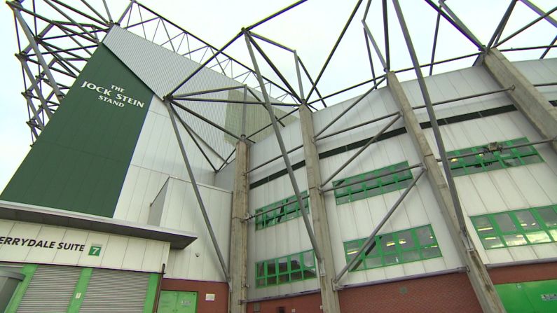 One of the large stands at Celtic Park, the 60, 000-seater home stadium of Celtic Football Club. The arena has been dubbed "Paradise" by the fans, many of whom travel from Ireland each fortnight to see the "Bhoys" play at home. 