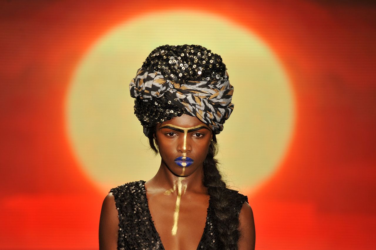 A model shows off an example of extravagant headwear from the House of Dereon collection.
