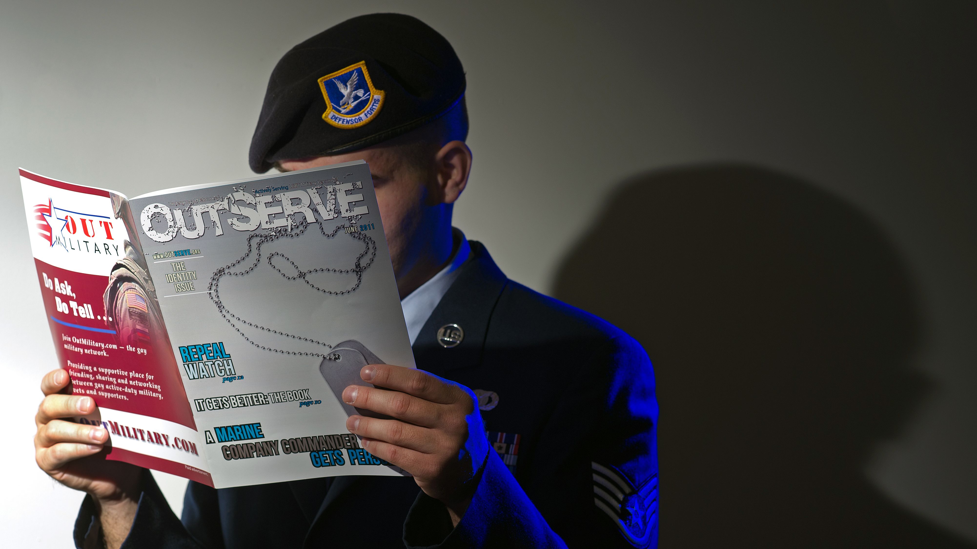 A member of the Air Force reads a copy of OutServe, a magazine for lesbian, gay, bisexual and transgender military personnel.