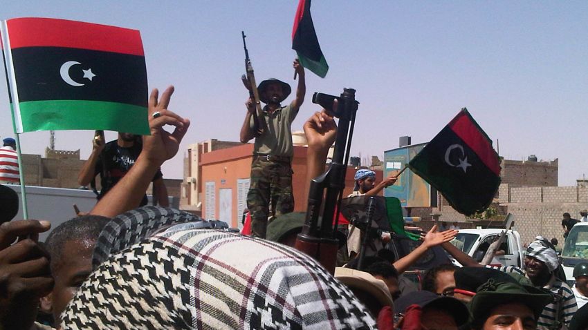 Opposition fighters chanting and dancing in streets of Sabha, Libya on September 20, 2011. 