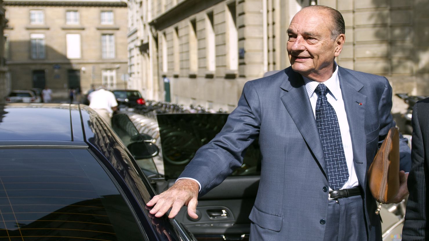 Former French President Jacques Chirac arrives at his office, September 1. 