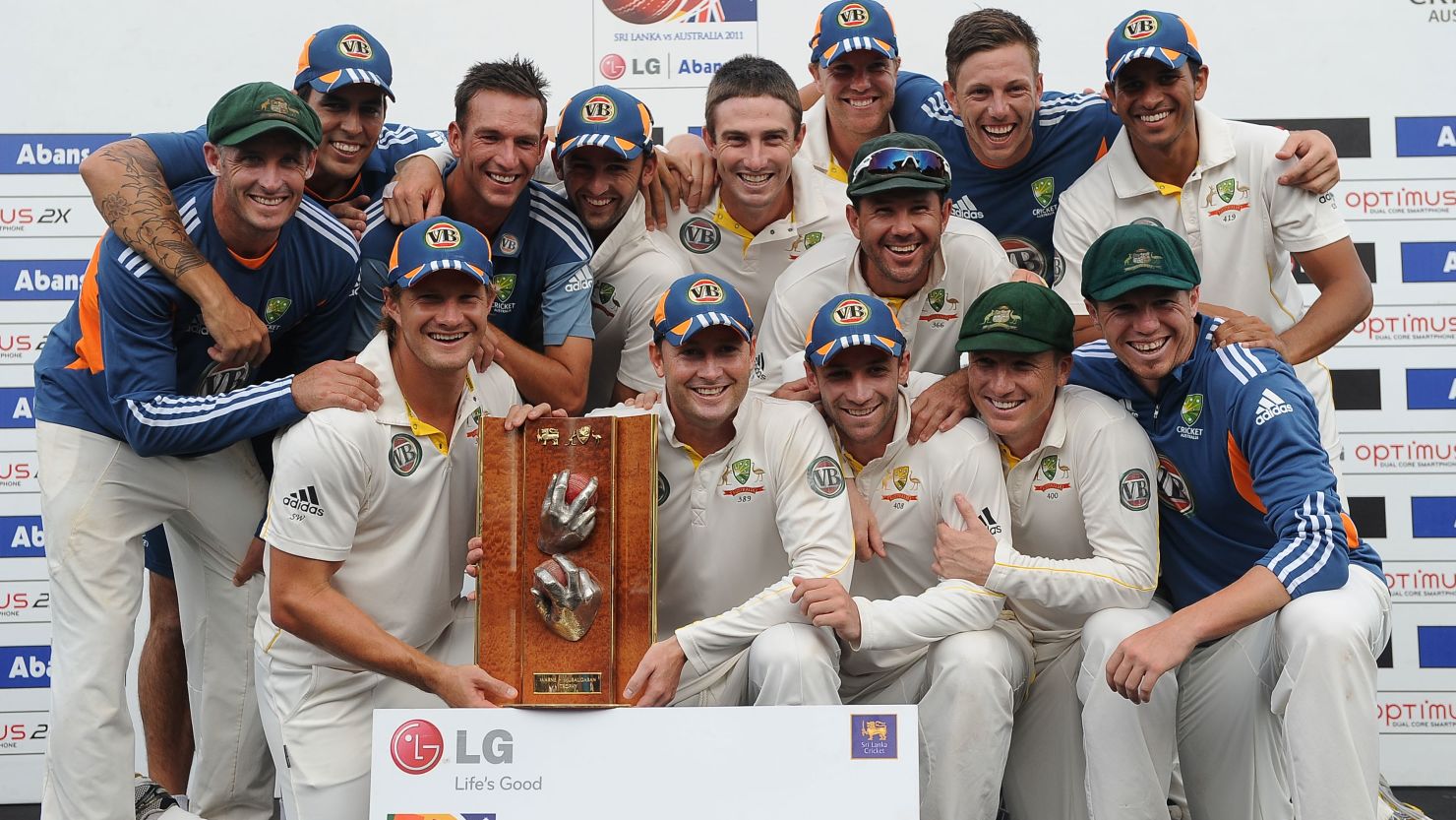 Australia led by captain Michael Clarke (center) celebrate after victory in the Test match series against Sri Lanka in Colombo