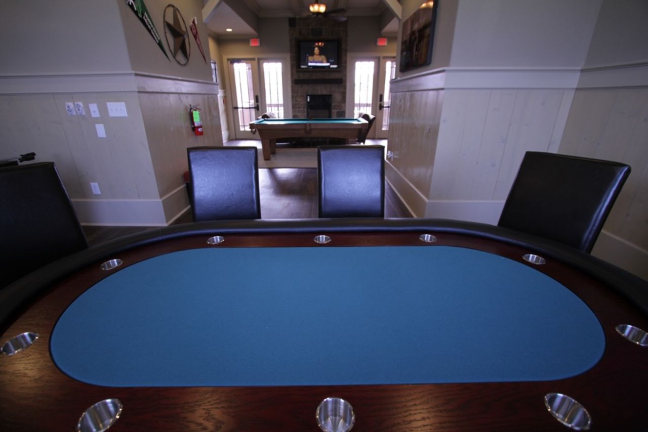 Among the resort-like amenities at The Retreat is a gameroom that features billiards, foosball and a poker table.
