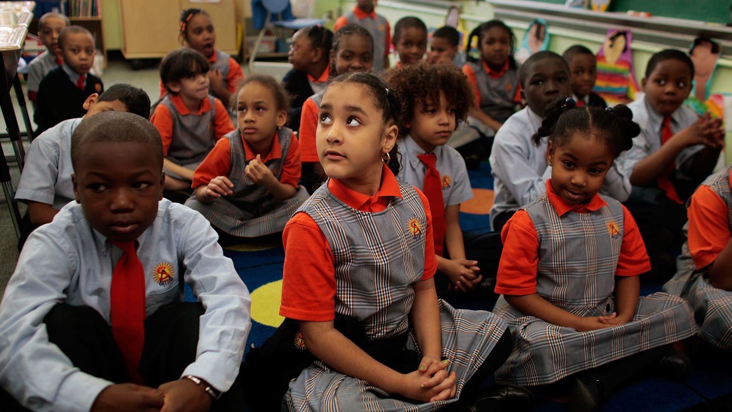 Students sit patiently at Harlem Success School, praised in the book "Class Warfare" as a high-achieving charter school.