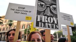 Amnesty International activists hold banners in support of Troy Davis at the U.S. Embassy in Rome on September 16.