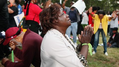 Lillie Sutton prays after hearing that there had been a delay in the execution of Troy Davis as protesters gathered at Jackson State Prison in Georgia. Davis was later executed on Wednesday, however.