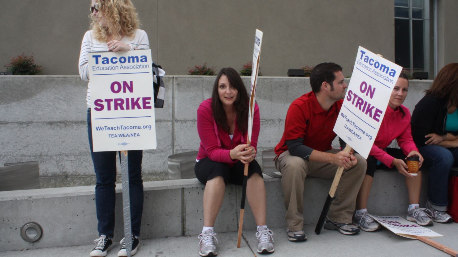 Teachers in Tacoma, Washington, hold picket signs outside a school last week.