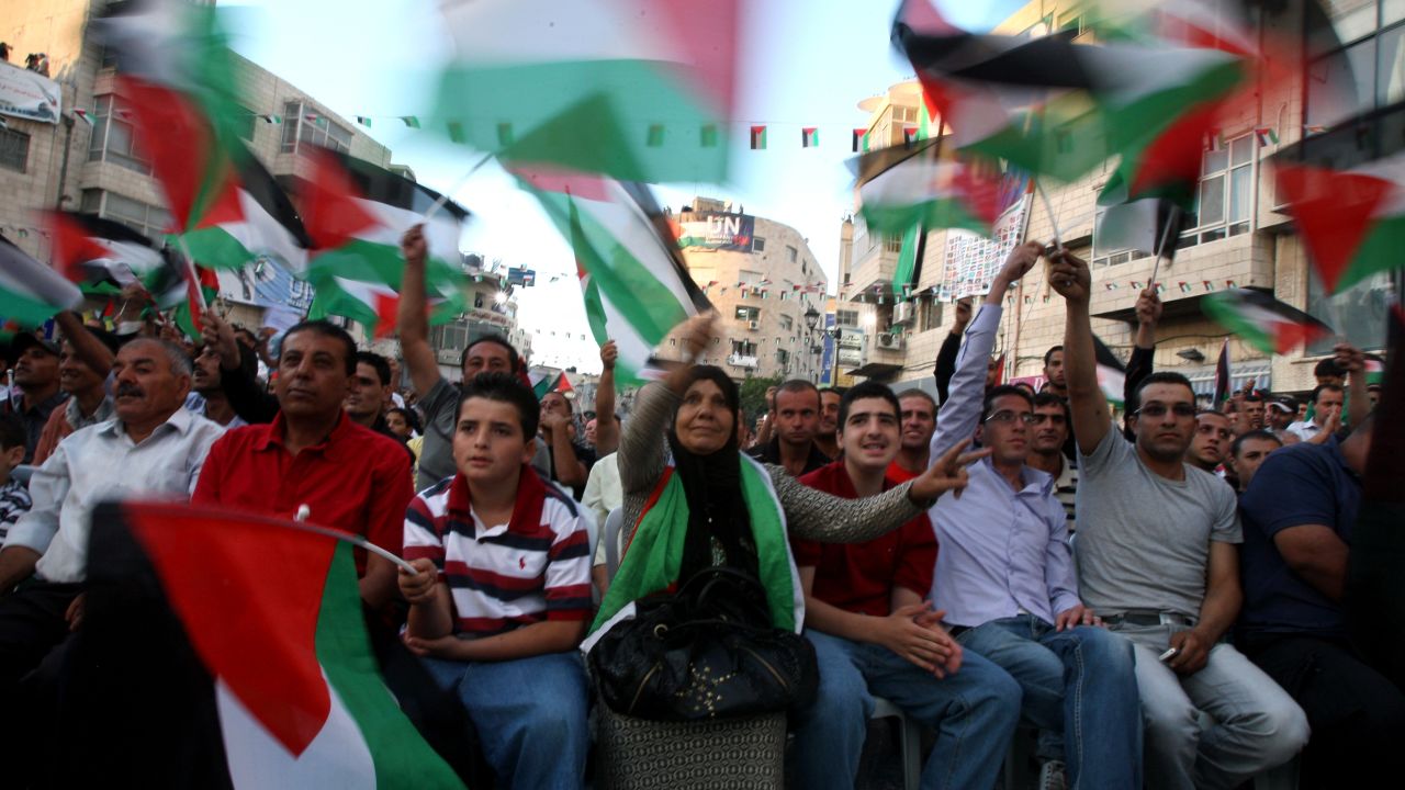 Palestinians watch Mahmoud Abbas' U.N. speech live on a wide screen set up in a Ramallah square. Hundreds gathered.