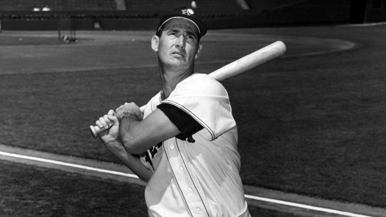 Ted Williams swings the bat in a photo taken circa 1955.