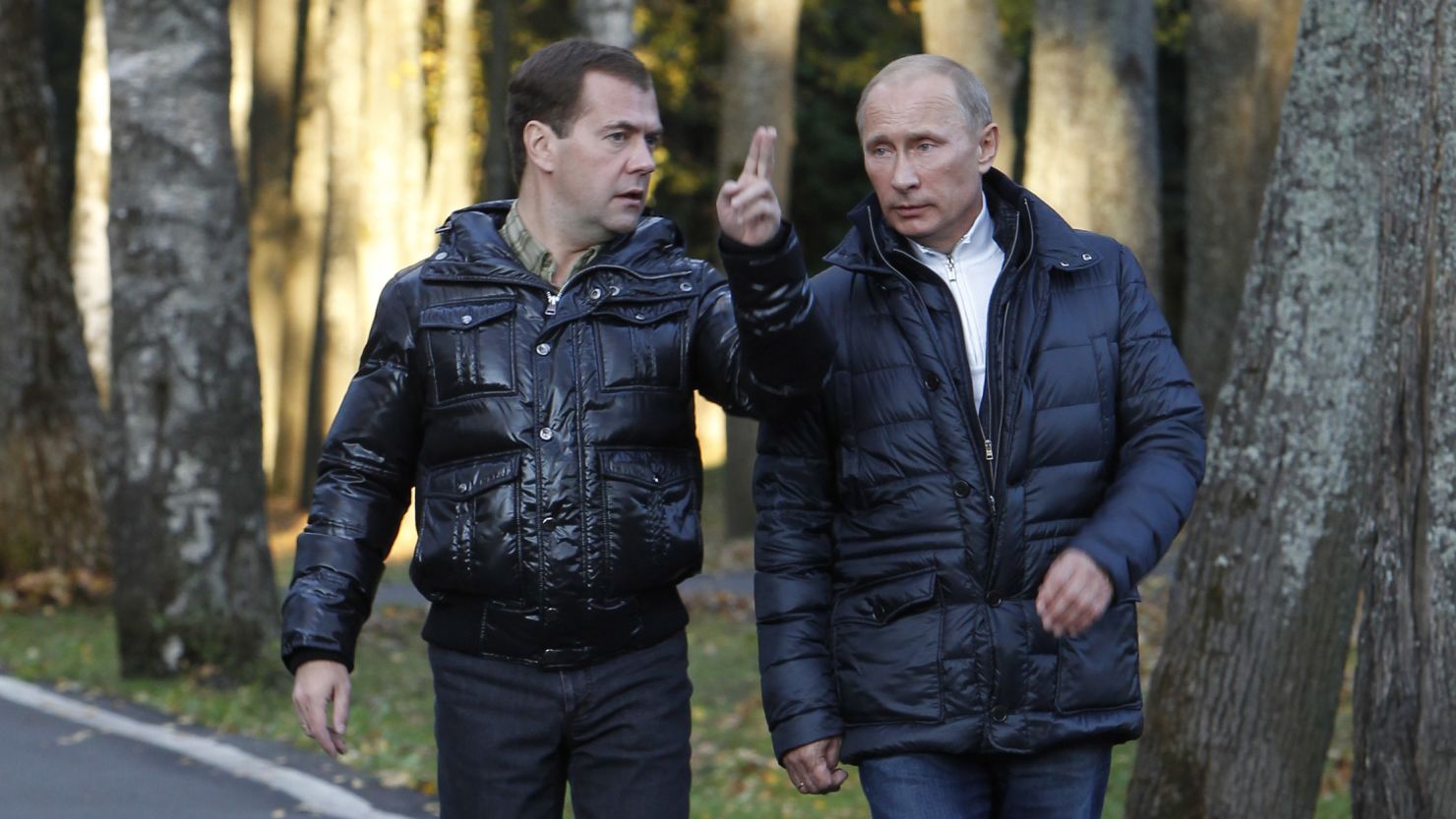 Russia's President Dmitry Medvedev, left, walks with Prime Minister Vladimir Putin in the Tver region on September 24.