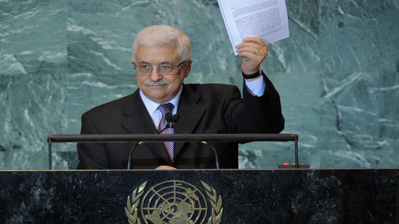 Mahmoud Abbas holds a copy of the letter requesting Palestinian statehood as he speaks at the U.N. on September 23, 2011.