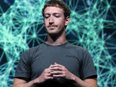 Even Zuckerberg looks a little bored with his T-shirt in this photo.