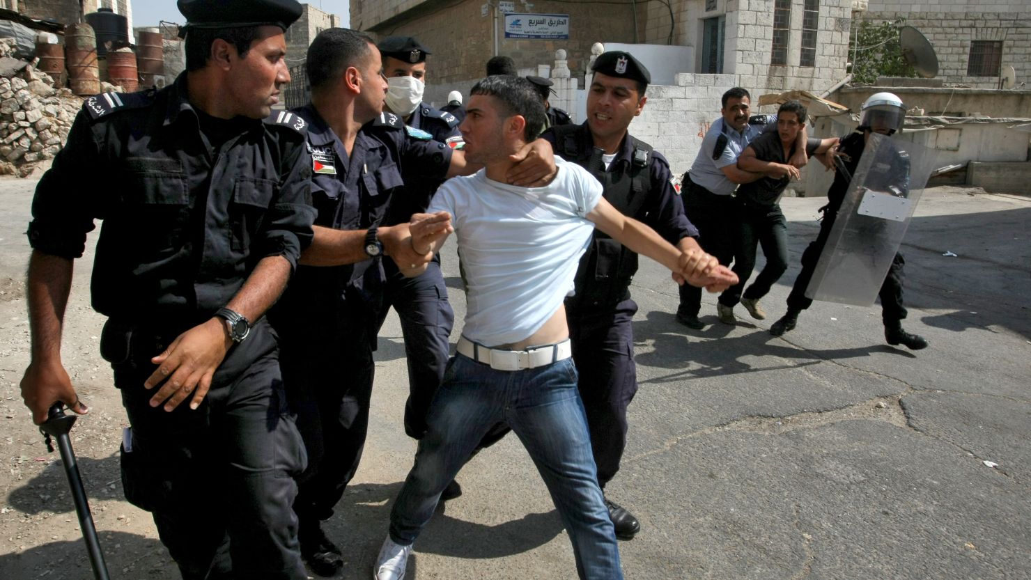 A Palestinian youth protests near the Jewish settlers zone of Abraham Avino in the West Bank city of Hebron on September 21.