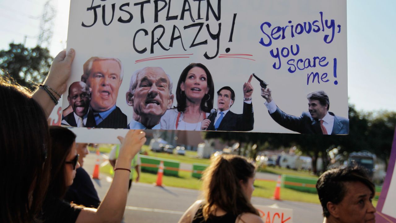 Protesters outside the  CNN/Tea Party Express GOP presidential debate September 12 in Tampa, Florida. 