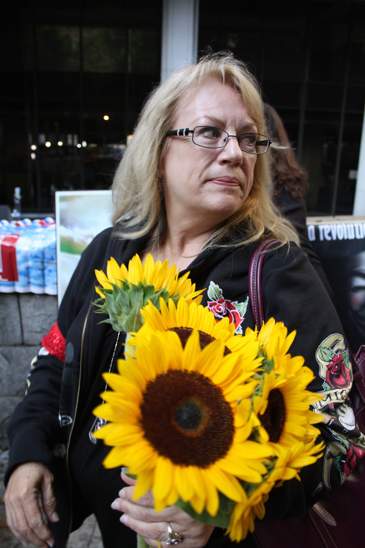 Betty Byrnes passed out sunflowers for a Michael Jackson support group called "Call for Love." "It's the first day of justice and that's really exciting, but there's not going to be any real justice. It won't bring him back," she says.
