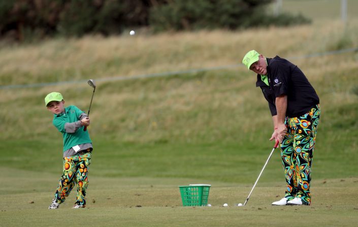 John Daly, winner of the 1995 Open Championship at St. Andrews, practises with his eight-year-old son, John Daly Jnr. 