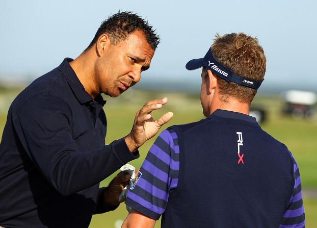 Dutch football legend Ruud Gullit in discussion with world number one Luke Donald.