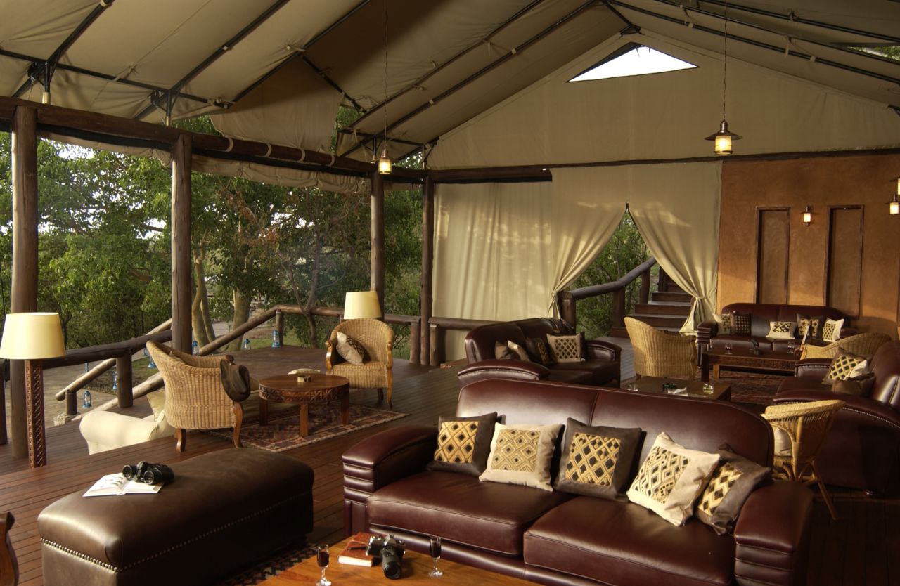 In addition to the luxurious guest tents, a lounge, restaurant, sundecks and swimming pool overlook the vast Tanzanian bush.