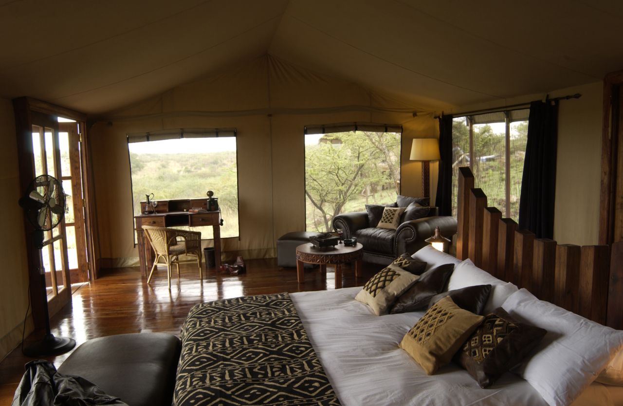 Tents at the Serengeti Migration Camp in Tanzania have hardwood floors and plush bedding.