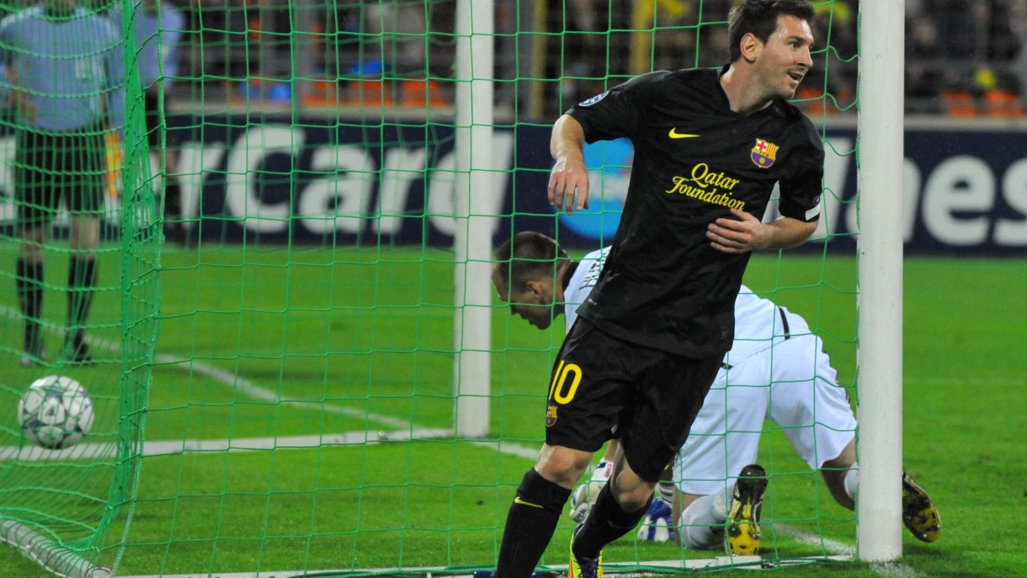 Lionel Messi celebrates the first of his two goals as Barcelona cruised to victory in Belarus