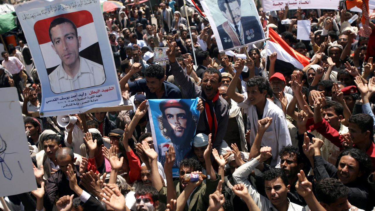 Yemeni opposition demonstrators shout slogans during an anti-regime protest in Sanaa on Wednesday.