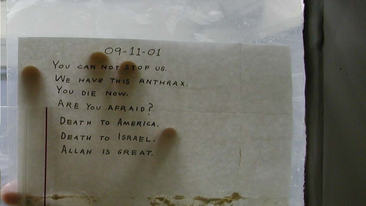 A scientist shows the anthrax-tainted letter sent to Sen. Tom Daschle's Capitol Hill office in fall 2001.