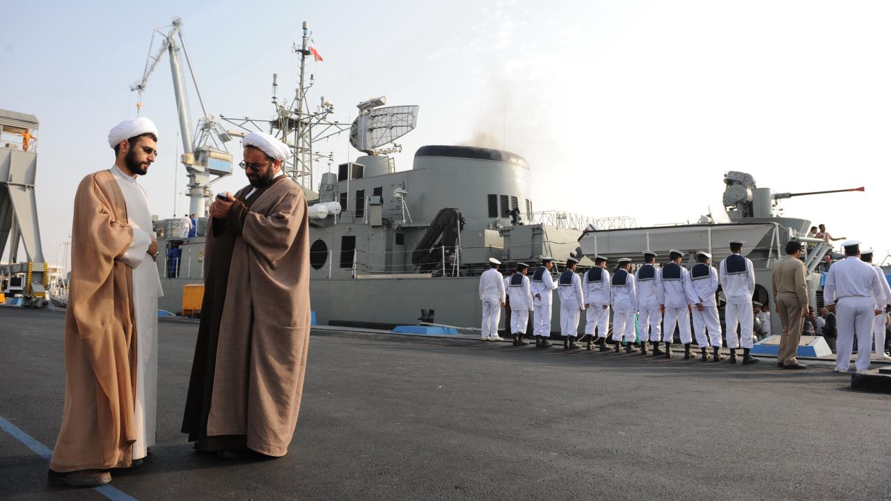 Iranian clerics in front of the Jamaran, Iran's first domestically built warship, during naval maneuvers in the Gulf in 2009.
