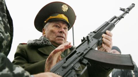 Designer of the AK-47, Mikhail Kalashnikov, is handed an AK-74, a refined version of the rifle, on November 23, 2002 in Izhevsk.
