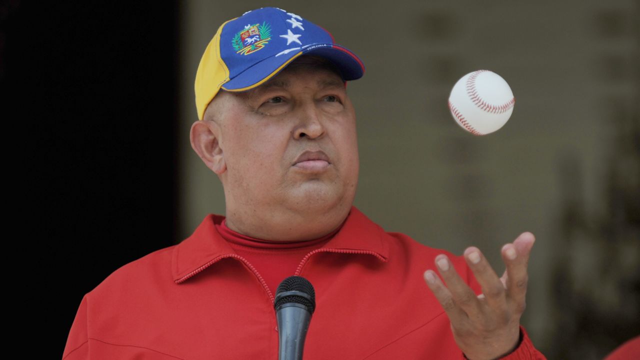 Venezuelan President Hugo Chavez tosses a baseball in the air during a press event at the presidential palace Miraflores.